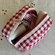 Gingham Pouch in Cherry Kiss with assorted hair care and accessories