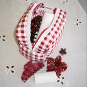 Gingham Pouch in Cherry Kiss with assorted emi jay accessories and hair care