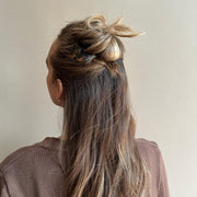 Model wearing Hair Pin in Tortoise in hair.