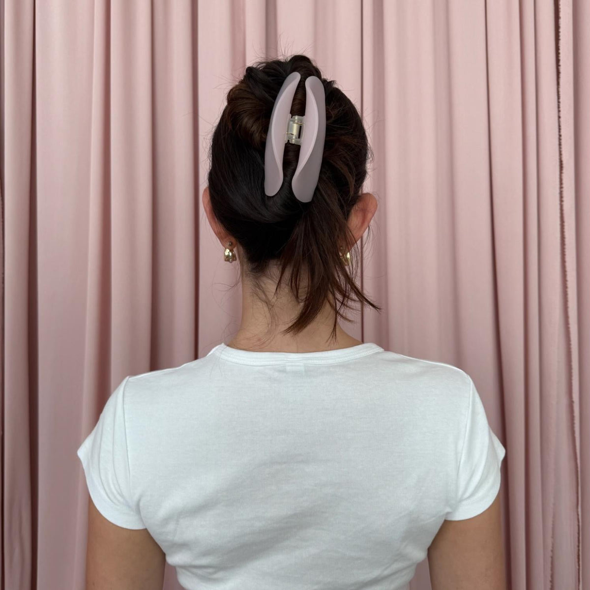 model wearing Half Moon Clip in Pink Smoke in hair