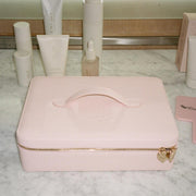 On The Way Vanity Case on marble counter with assorted emi jay hair care and mirror
