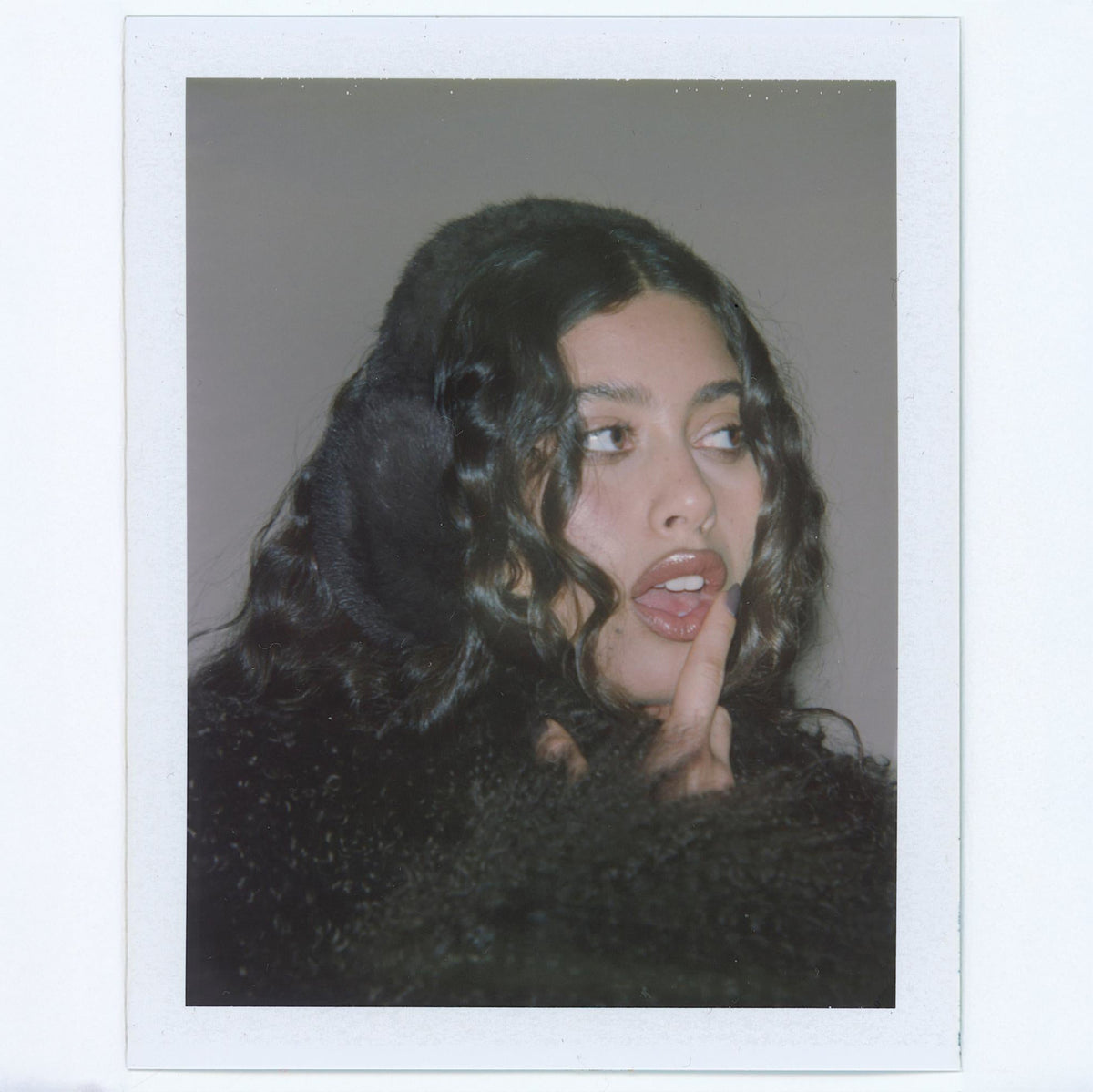 Polaroid of model wearing Sugar Muffs in Espresso Martini.