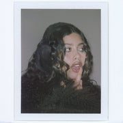 Polaroid of model wearing Sugar Muffs in Espresso Martini.