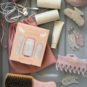 Angel Essentials Kit with assorted hair care, accessories, and headphones in a plastic tray