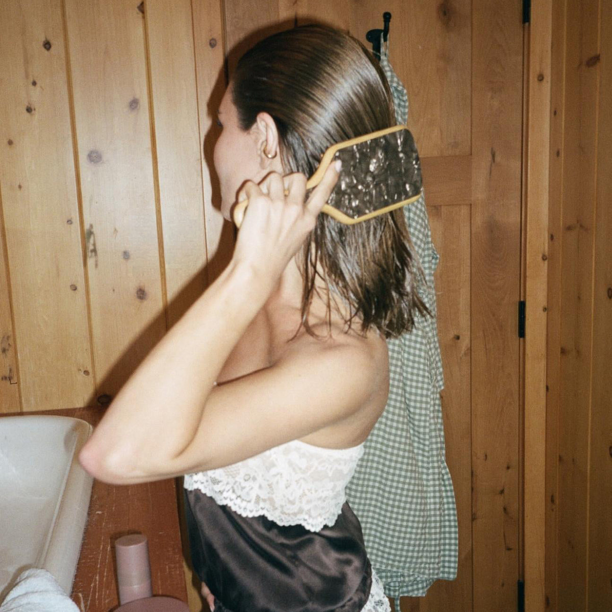 olivia jade brushing hair with bamboo paddle brush