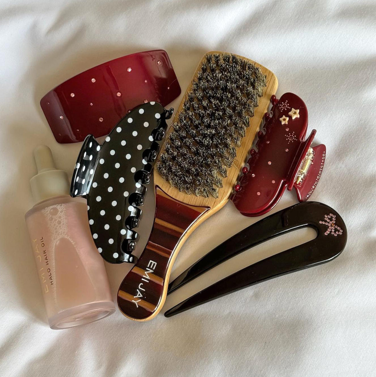 assorted emi jay nightcap hair accessories with halo hair oil