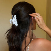 model touching hair while wearing Big Effing Clip in Blanc Fleur Eyelet