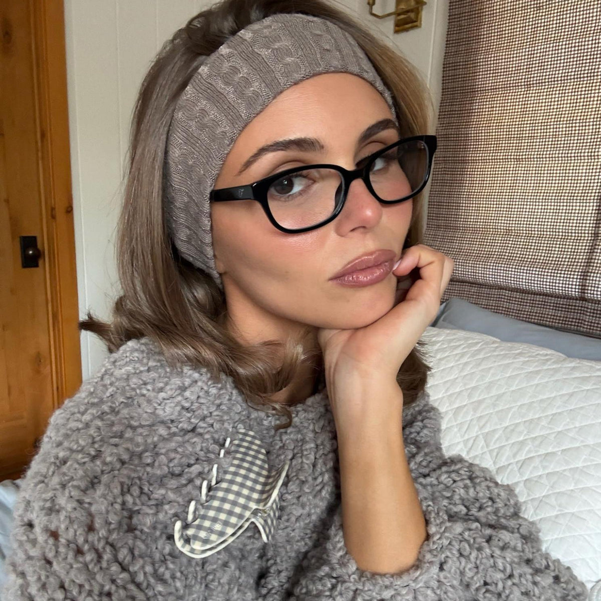 Olivia Jade wearing Infinity Headband with Big Effing Clip attached to sweater