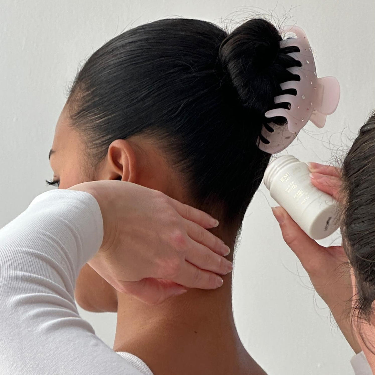 model wearing Big Effing Clip in Everyday Angel while having angelstick applied to hair