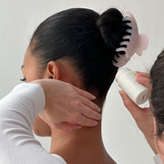 model wearing Big Effing Clip in Everyday Angel while having angelstick applied to hair