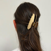 model wearing Big Effing Clip in Milk and Cookies in hair