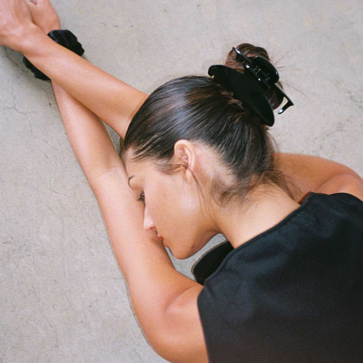 model wearing Sweet Dreams Silk Scrunchie in Night Owl + Big Effing Clip in Noir in hair