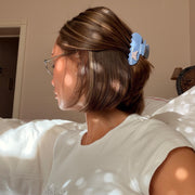 model wearing sweetheart clip in bluebell flutter in hair