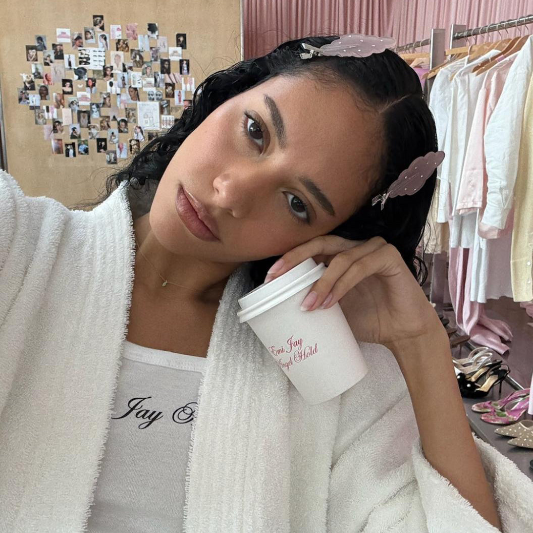 model wearing white robe and emi jay angel tank top with Cloud Popstar Clips in Angel Wish in hair while holding emi jay angel hold coffee 