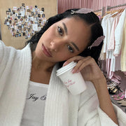 model wearing white robe and emi jay angel tank top with Cloud Popstar Clips in Angel Wish in hair while holding emi jay angel hold coffee 