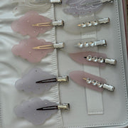 assorted emi jay popstar hair clip attached to vanity case