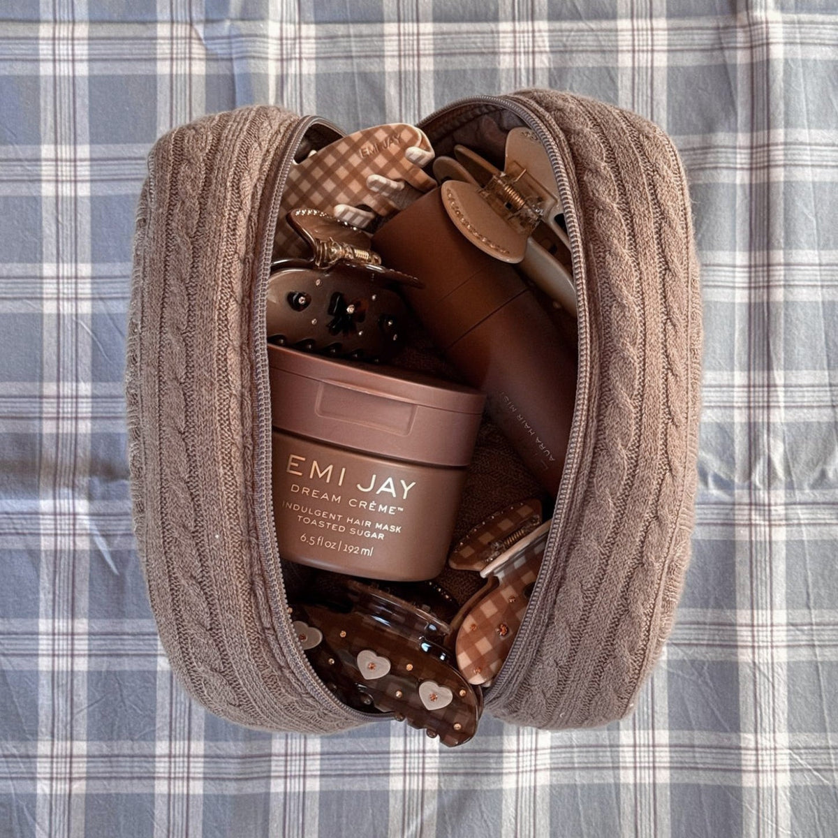 Cozy Pouch in Cookie Crumbs Knit with assorted hair care and accessories