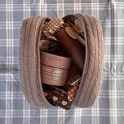 Cozy Pouch in Cookie Crumbs Knit with assorted hair care and accessories