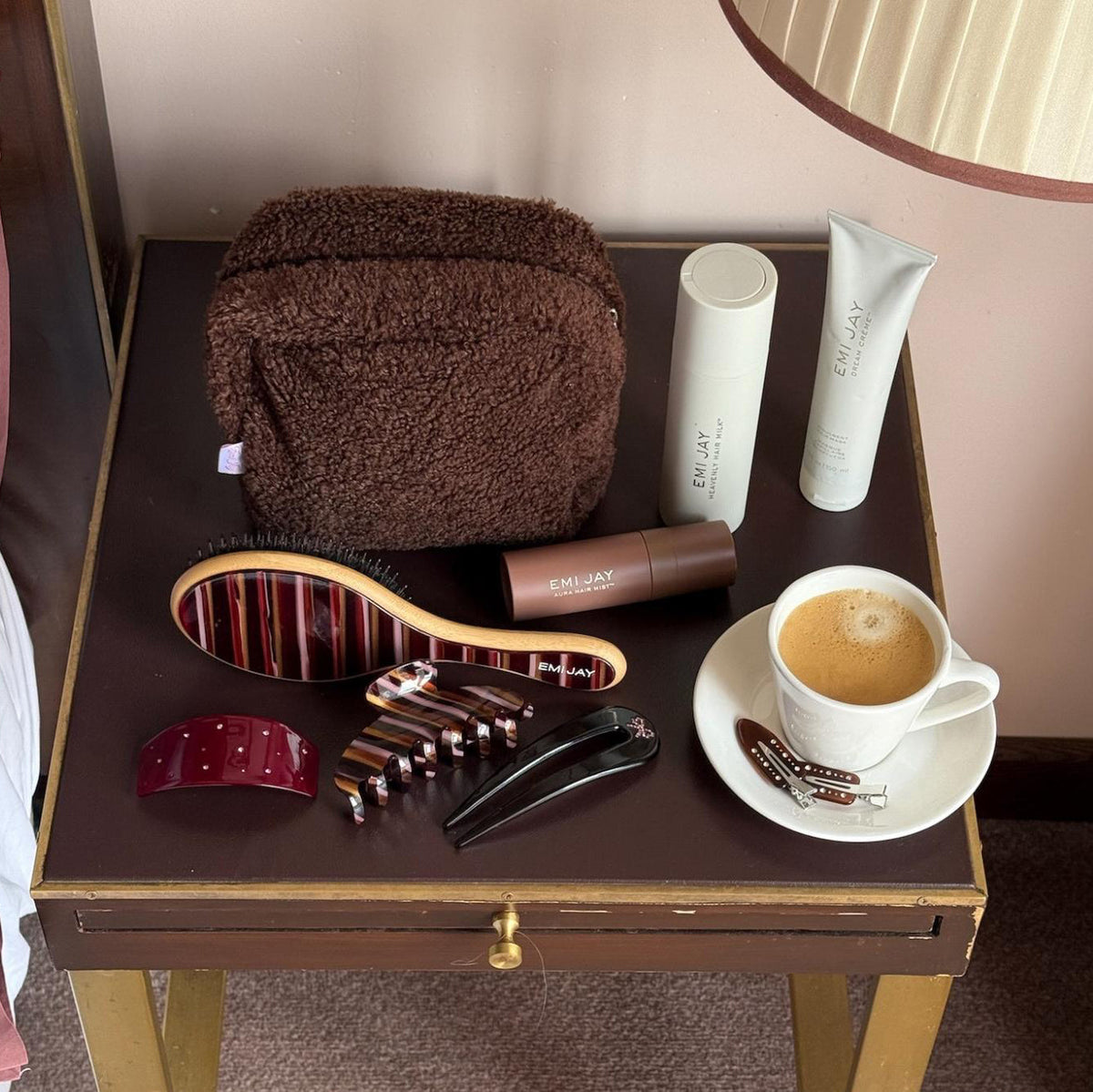 assorted emi jay hair care and accessories on table with coffee