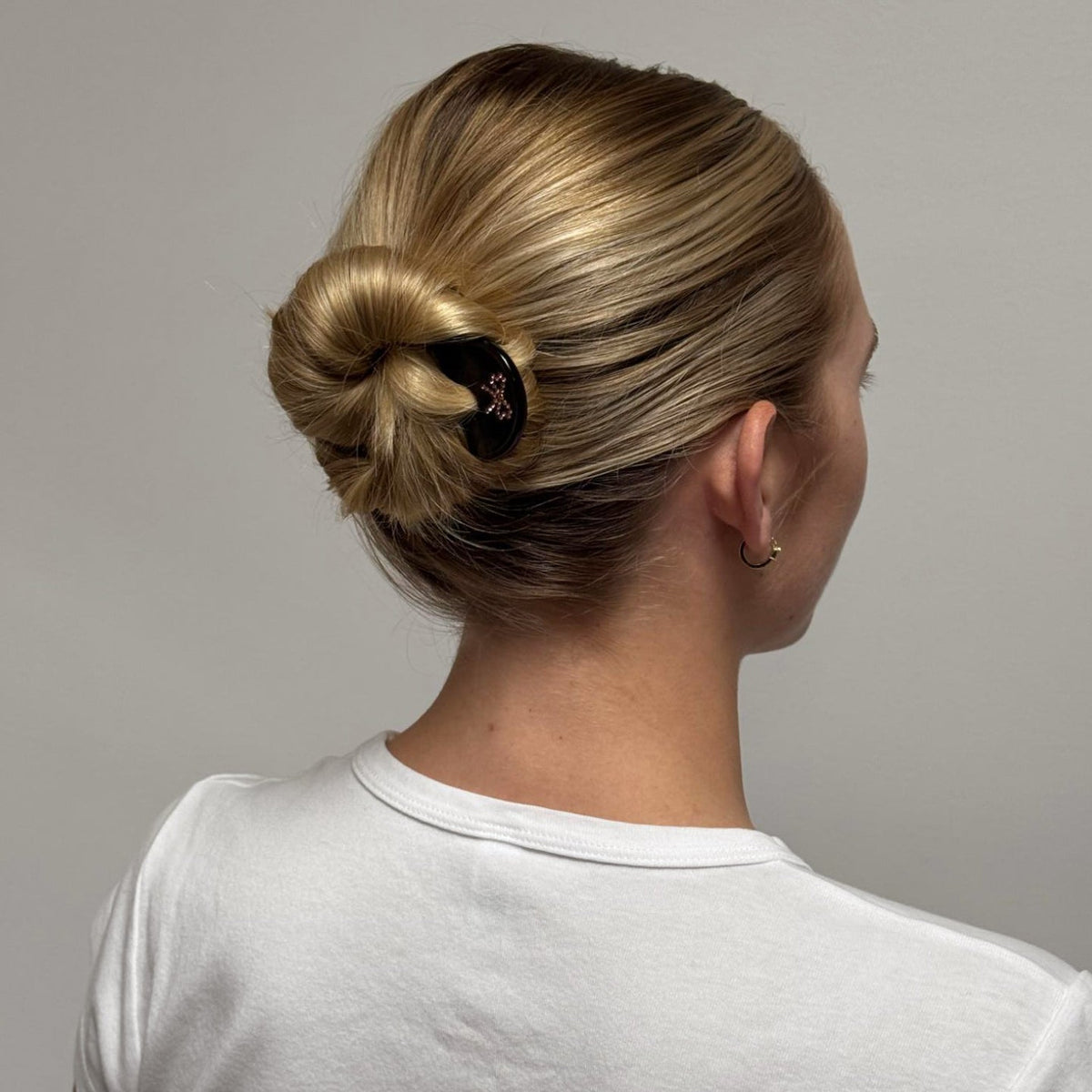 model wearing Iconic Velvet Bow Barrette in Cabernet in hair