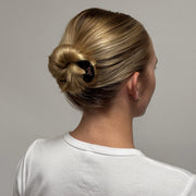model wearing Iconic Velvet Bow Barrette in Cabernet in hair
