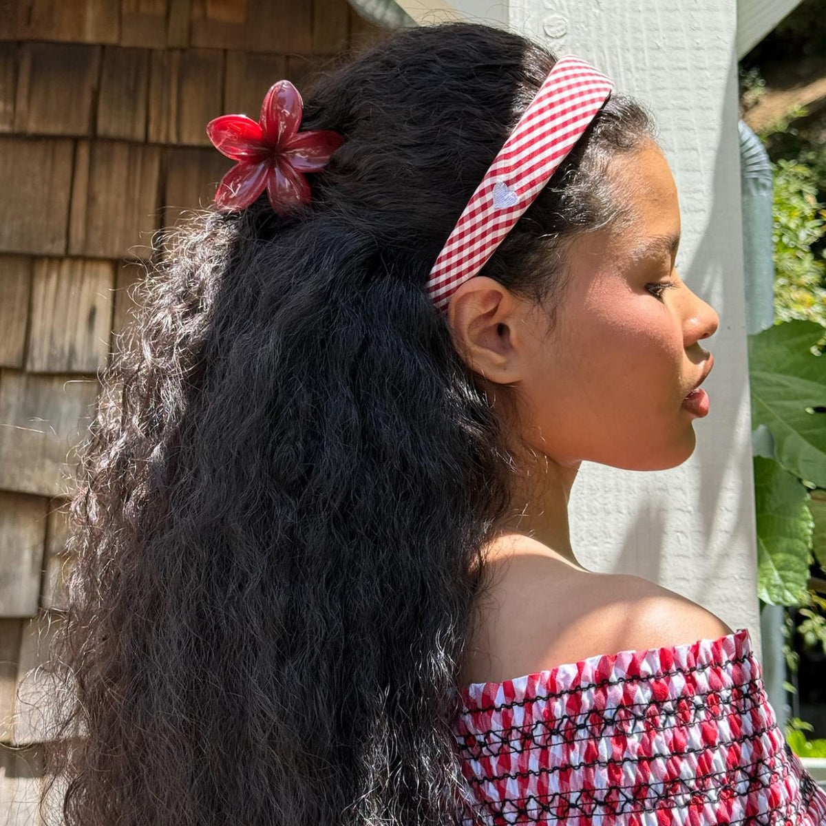 model wearing Halo Headband in Cherry Gingham and super bloom clip
