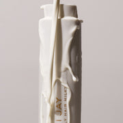 heavenly hair milk bottle with top up and being covered with milk