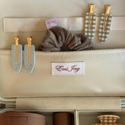 assorted emi jay hair care and accessories in vanity case