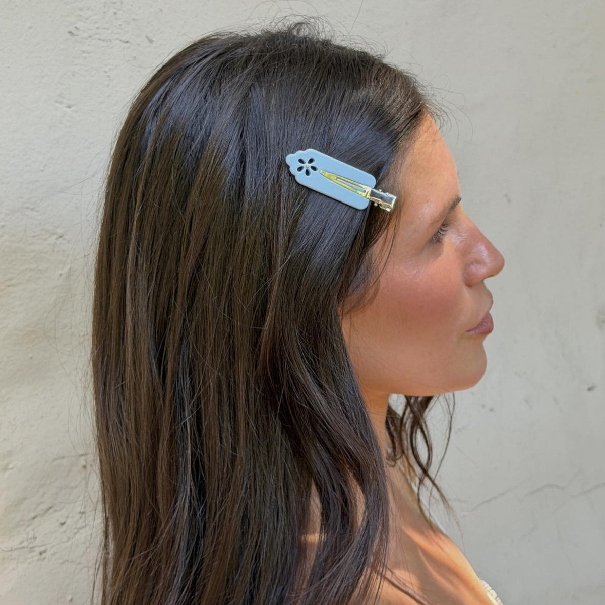 model wearing Popstar Clips in Blue Mist Eyelet in hair