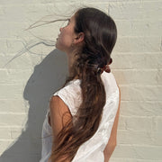 model wearing Super Bloom Clip in Tamarind in hair