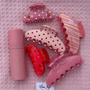 Aura Hair + Body Mist in Lychee Baby with assorted Emi Jay hair clips on Heavenly Hair Towel