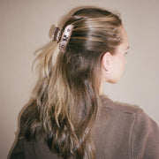 Model wearing Sweetheart Clip in Cocoa Cashmere in hair.