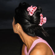 model wearing 2 Sweetheart Clips in Palm Blossom in hair