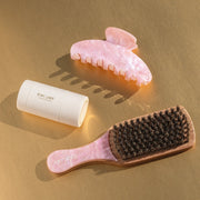 angelstick, big effing clip, and mini boar brush on gold background